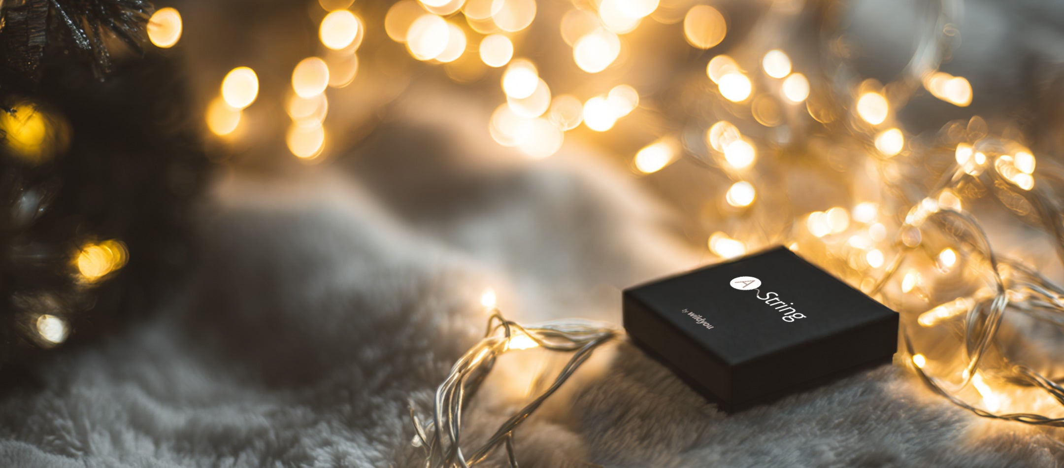 WILDYOU A-String gift box wrapped in fairy lights